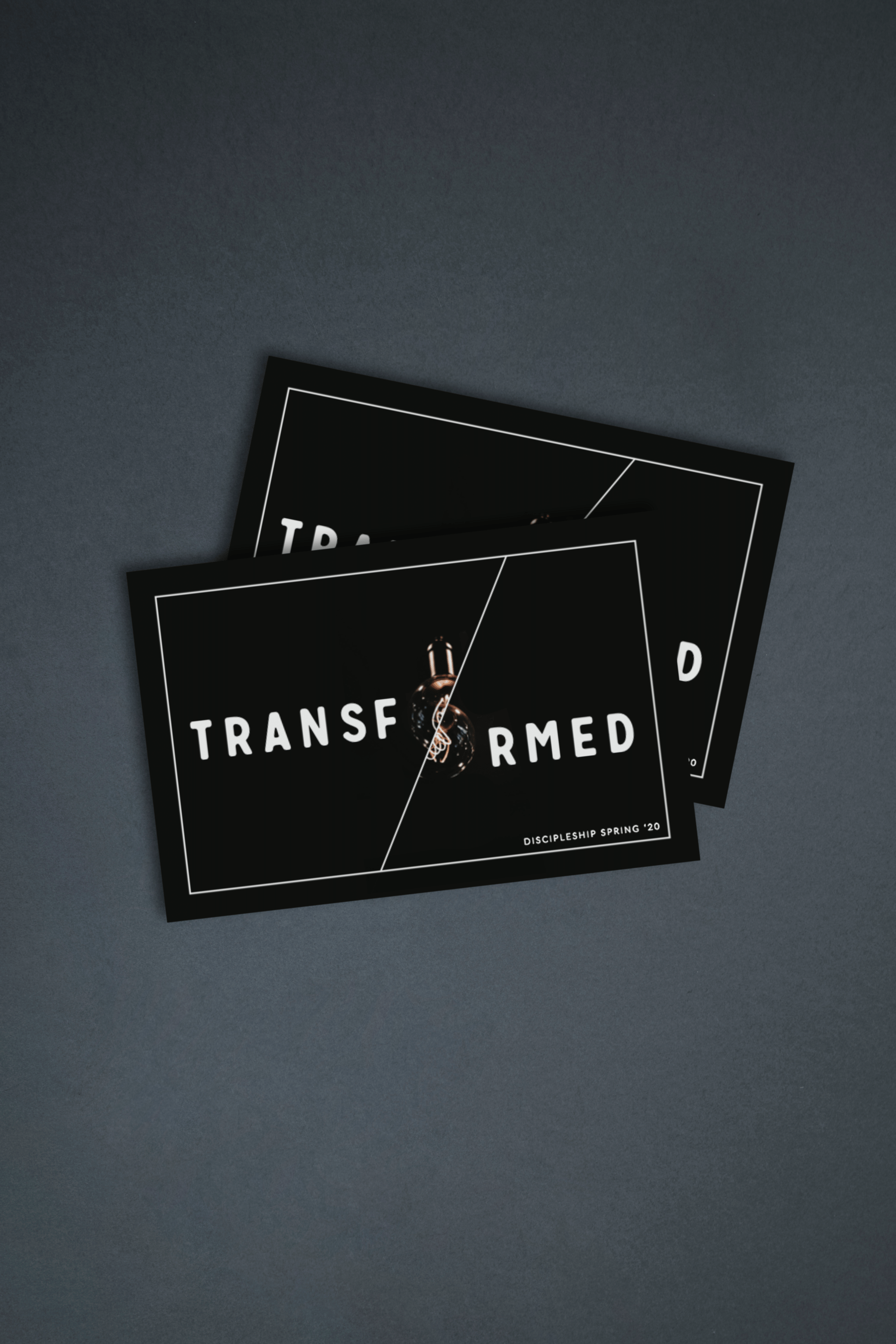 A multi-page brochure with the title Transformed, the O of transformed is a vintage lightbulb that has been cut in half and offset.