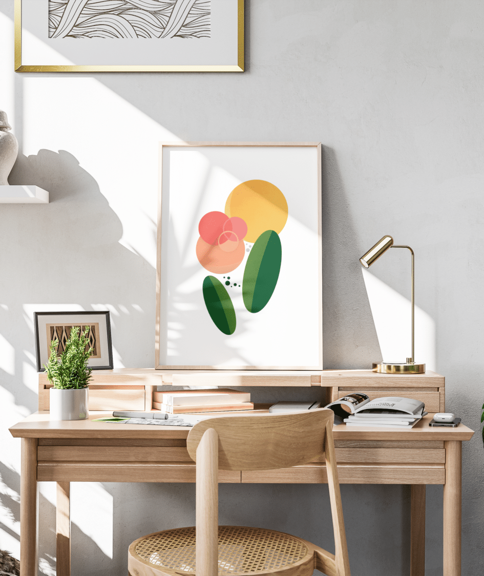 This print was inspired by the relationship between plants or flowers and the sun. This abstract print contains colors of green, yellow, and pinks, with shapes of circles and ovals. The print sits on top of a desk with the sun streaming in through the window, casting shadows upon the scene.