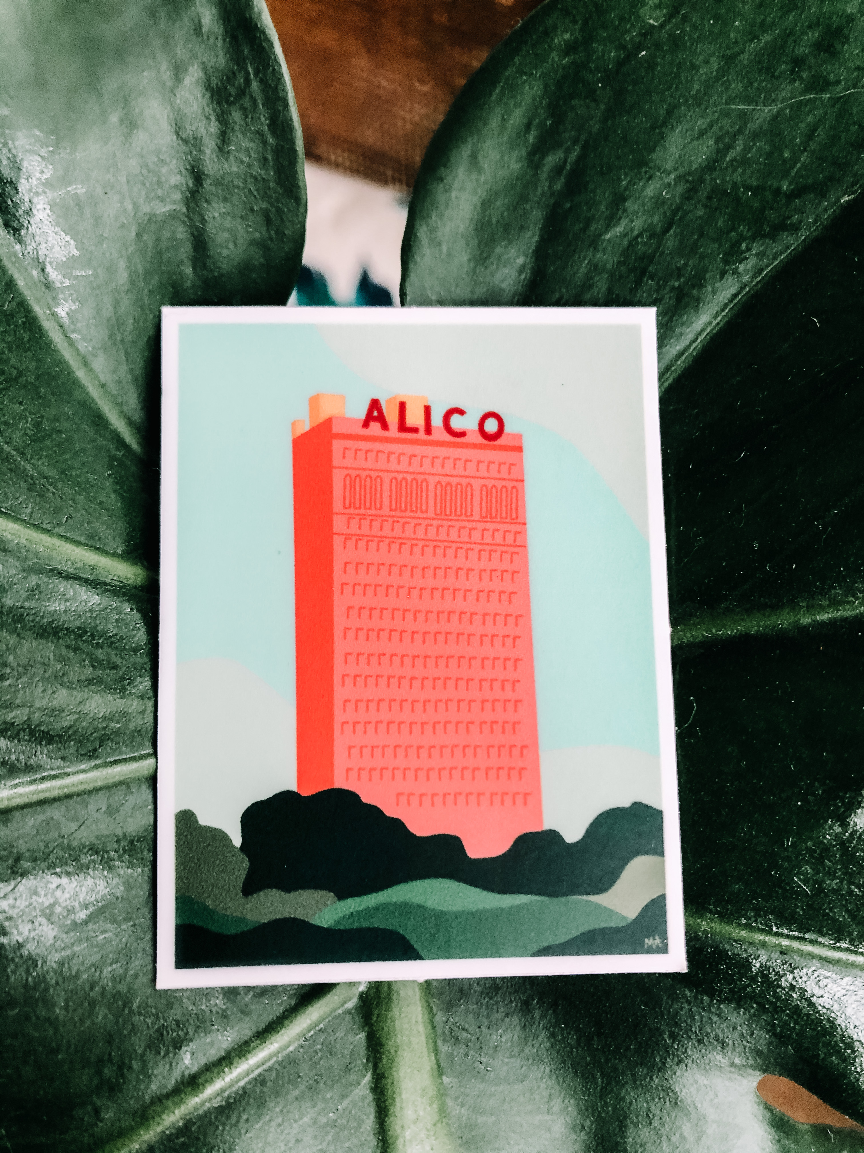 This print contains an illustration of the Alico Building located in Waco, Texas. The color palette contains various shades of green, blue, and pinks.