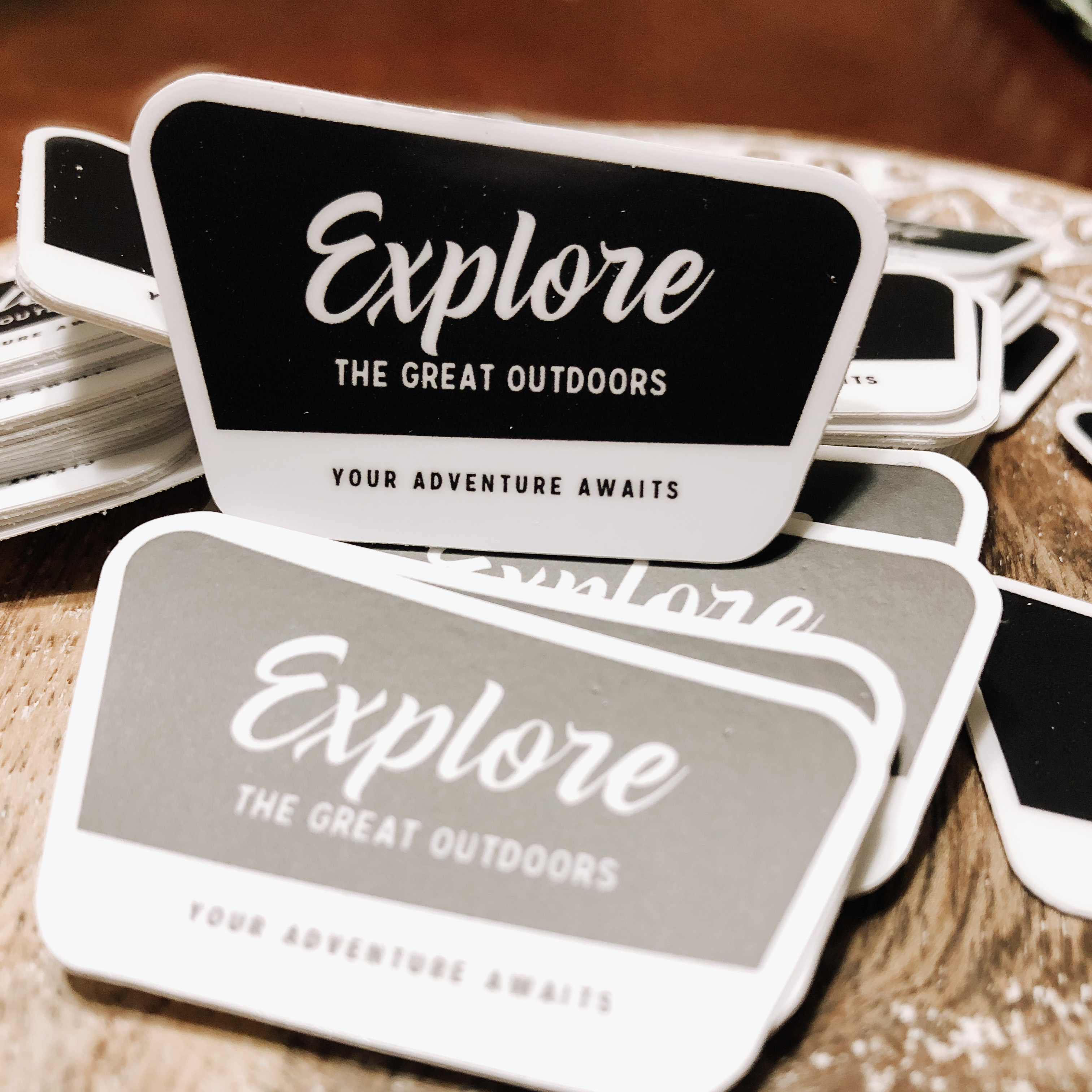 This sticker was designed to resemble the US National Parks signs in black and white. The words on the sticker say the following, Explore the Great Outdoors - Your Adventure Awaits.